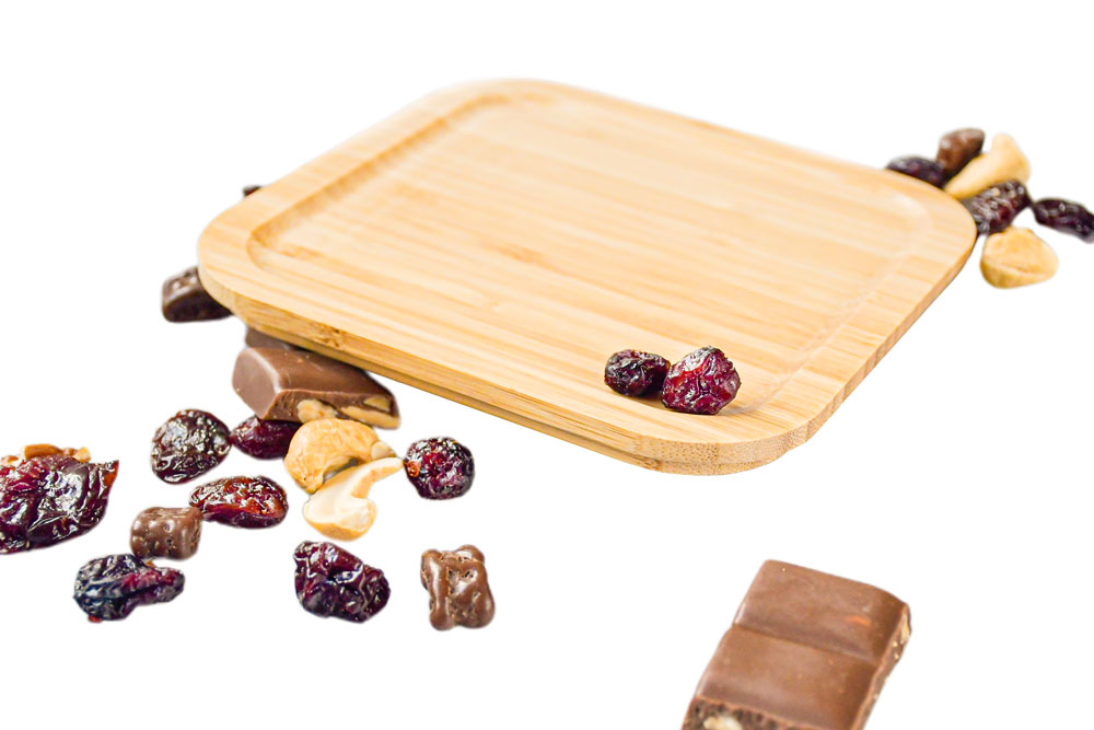 Side view of square bamboo lid next to dried fruit – eco-friendly replacement part for lunch box
